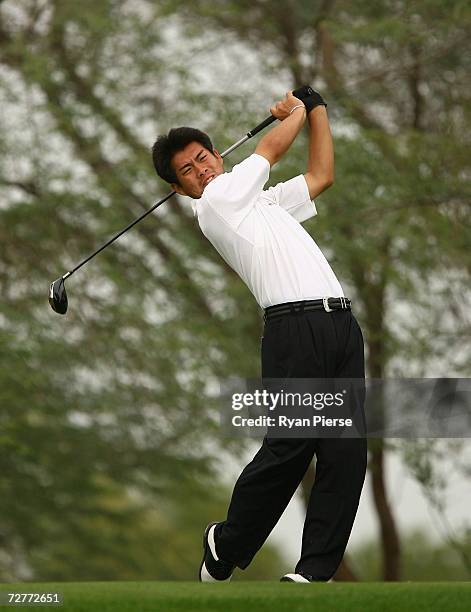 Yuki Ito of Japan hits his tee shot on the 18th Hole during round one of Men's Golf during day eight of the 15th Asian Games Doha 2006 at Doha Golf...