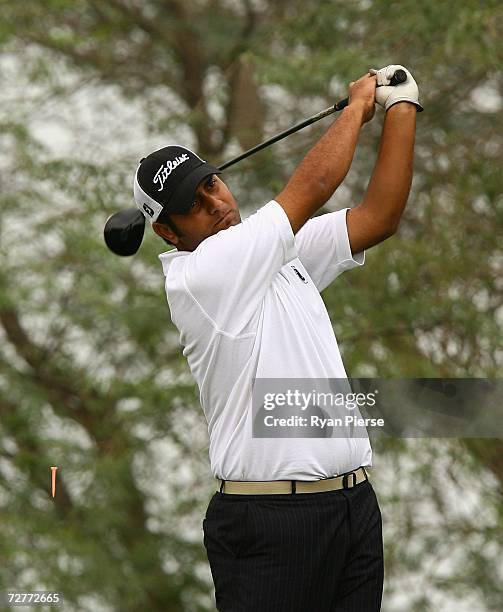 Vaqas Ahmed of Pakistan hits his tee shot on the 18th Hole during round one of Men's Golf during day eight of the 15th Asian Games Doha 2006 at Doha...