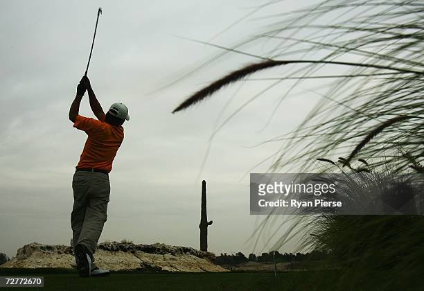 Chen Chih Chiang of Chinese Taipei hits his drive from the 14th Tee during round one of Men's Golf during day eight of the 15th Asian Games Doha 2006...