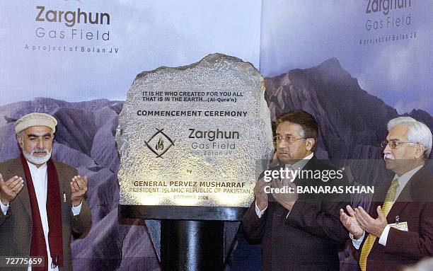 Pakistani President Pervez Musharraf prays with Governor of Baluchistan province, Awais Ahmed Ghani after inaugurating the Zarghun Gas Field project...