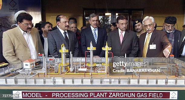 Pakistani President Pervez Musharraf looks at a model of Zarghun Gas Field project in Quetta, 08 December 2006. Musharraf's visit to the troubled...