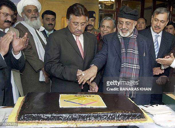Pakistani President Pervez Musharraf cuts a cake after inaugurating the Zarghun Gas Field project in Quetta, 08 December 2006. Musharraf's visit to...