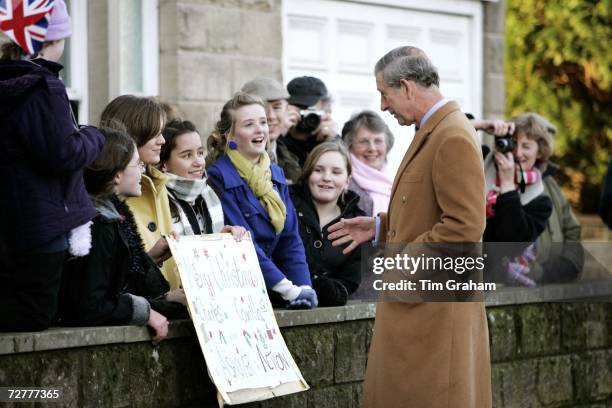 Prince Charles, Prince of Wales meets local school children and villagers during a walkabout in Ashover on December 8, 2006 in Ashover, England.