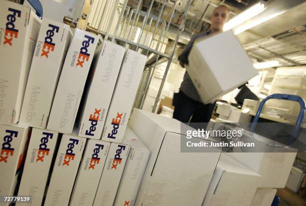 FedEx courier Nate Channing makes a pickup of packages from a Gump's store December 8, 2006 in San Francisco, California. FedEx is beginning to see...