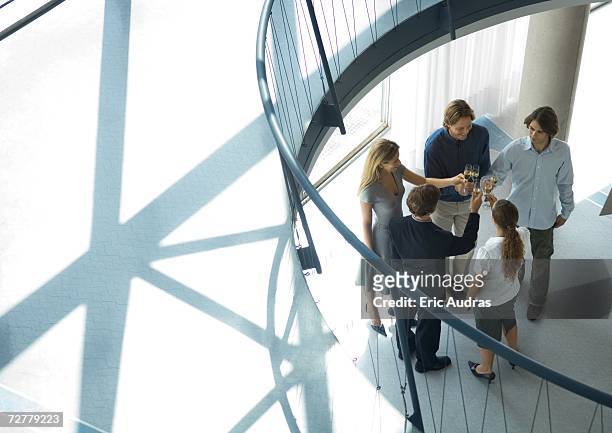 group of young executives making toast, high angle view - office party stock pictures, royalty-free photos & images