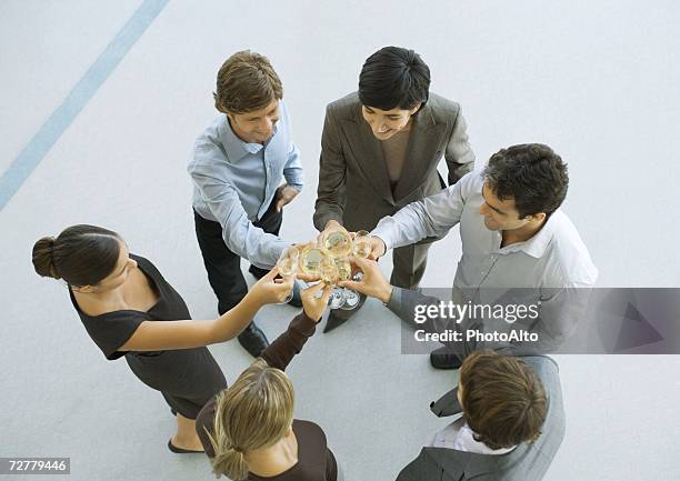 executives making a toast during cocktail party, high angle view - cocktail corporate stockfoto's en -beelden