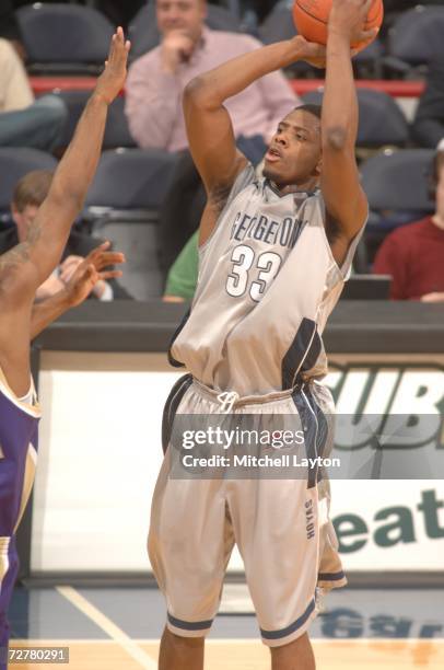 Patrick Ewing Jr. Of the Georgetown Hoyas takes a jump shot during a college basketball game against the James Madison Dukes at Verizon Center on...