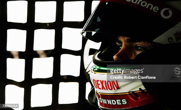 Craig Lowndes of Triple Eight Race Engineering sits in his car as he awaits to hit the track during qualifying for round 13 of the V8 Supercars at...