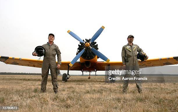 Pilots Gerard Lappin and Tim Foster prepare to fly Dromader waterbombing aircraft holding 2600 litres of flame retardant as conditions become worse...