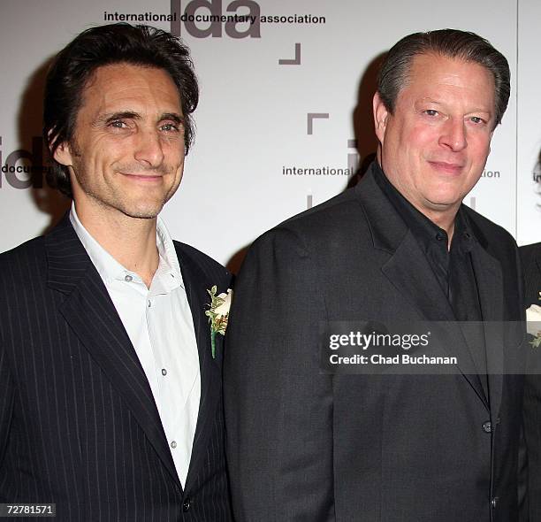 Producer Lawrence Bender and former Vice President Al Gore attend the 2006 International Documentary Association Achievement Awards gala at the...