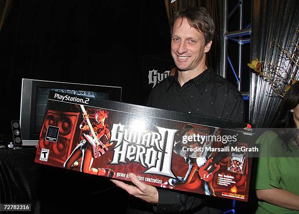 Pro-Skater Tony Hawk poses with the Guitar Hero display at the distinctive assets gift lounge during Spike TV's Video Game Awards held at The Galen...