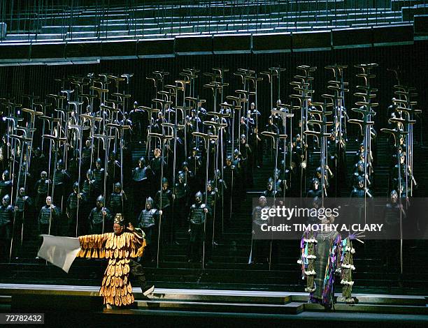 New York, UNITED STATES: Mezzo-soprano Michelle DeYoung as Shaman and Wu Hsing-Kuo as the Yin-Yang Master perform a scene during the dress rehearsal...