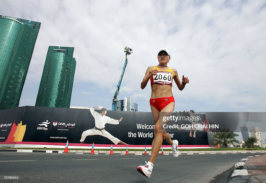 China's Zhou Chunxiu goes through her st