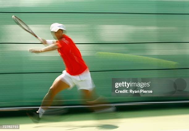 Lee Hyung Taik of Korea plays a forehand during his First Round Singles match against Karim Alayli of Libia during day nine of the 15th Asian Games...