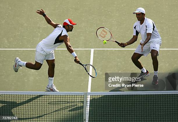 Leander Paes and Mahesh Bhupathi in action during their First Round Doubles match against Yu Hiu Tung and Wong Wing Luen Wayne of Hong Kong China...