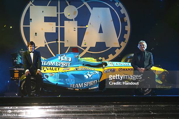Fernando Alonso of Spain, the FIA Formula One World Championship winner and Flavio Briatore of Italy, the Renault F1 team principal, onstage at the...