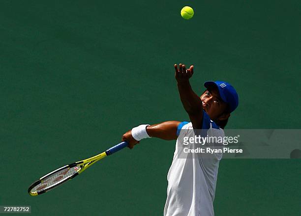 Sun Peng of China serves during his First Round Singles match against Rohan Bopanna of India during day nine of the 15th Asian Games Doha 2006 at at...