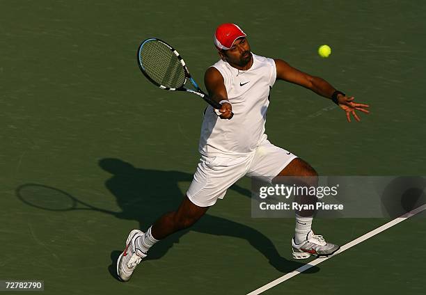 Leander Paes of India plays a volley during his First Round Doubles match with Mahesh Bhupathi of India against Yu Hiu Tung and Wong Wing Luen Wayne...