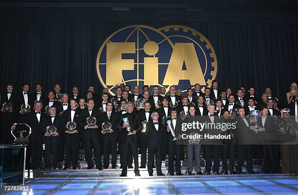 The FIA Trophy Winners stand on stage with their awards at the 2006 FIA Gala Prize Giving Ceremony held at the Salle des Etoiles Sporting Club on...