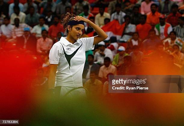 Sania Mirza of India looks on during her First Round Mixed Doubles match with Leander Paes of India against Murad Inoyatov and Dilyara Saidkhodjaeva...
