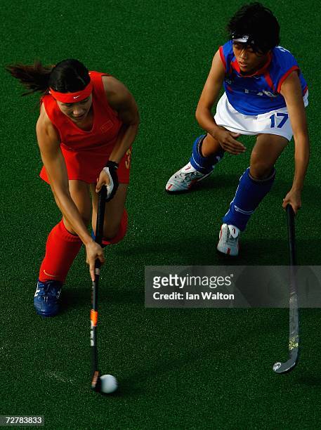 Su Pei Ling of Chinese Taipei tries to tackle Chen Zhaoxia of China during the game between China and Chinese Taipei during the Woman's Field Hockey...