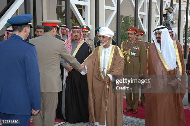 Saudi King Abdullah looks on as Sultan Qaboos of Oman is greeted by officials upon his arrival in Riyadh to attend the Gulf Cooperation Council...