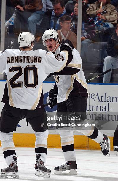 Evgeni Malkin of the Pittsburgh Penguins is congratulated by Colby Armstrong after scoring against the Atlanta Thrashers at Philips Arena December 9,...