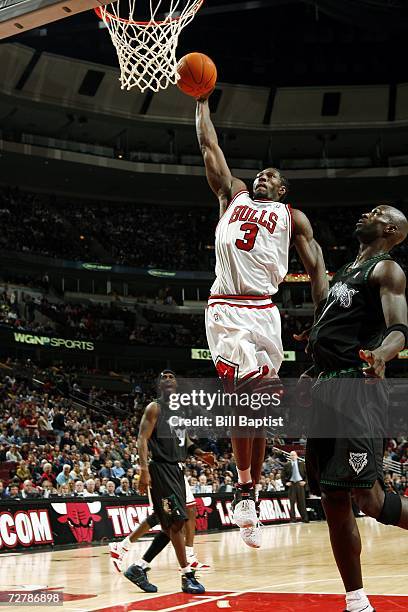 Ben Wallace of the Chicago Bulls goes to the basket past Kevin Garnett of the Minnesota Timberwolves during the NBA game on December 9, 2006 at the...