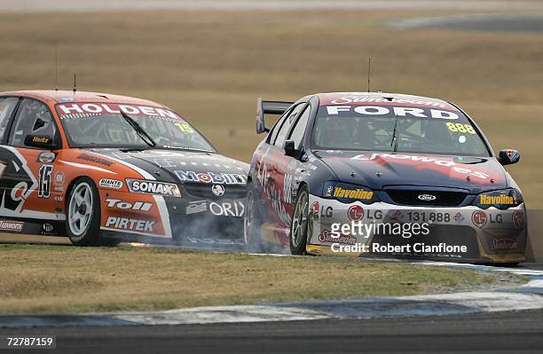 Rick Kelly of the Toll HSV Dealer Team nudges Craig Lowndes of Triple Eight Race Engineering during race three of round 13 of the V8 Supercars at the...