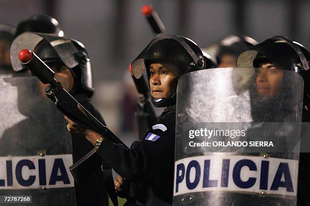 Quetzaltenango, GUATEMALA: Riot police take position at the Mario Camposeco stadium in Quetzaltenango City 09 December 2006. Supporters were injured...