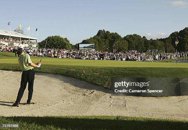 Nick O'Hern of Australia chips from a bunker during ther forth play-off of the 18th hole during the Australian PGA Championships at the Hyatt Regency...