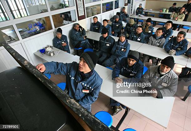 Foreign inmates attend a Chinese lesson after six of them finished the Hanyu Shuiping Kaoshi test at the Shanghai Qingpu Prison on December 10, 2006...