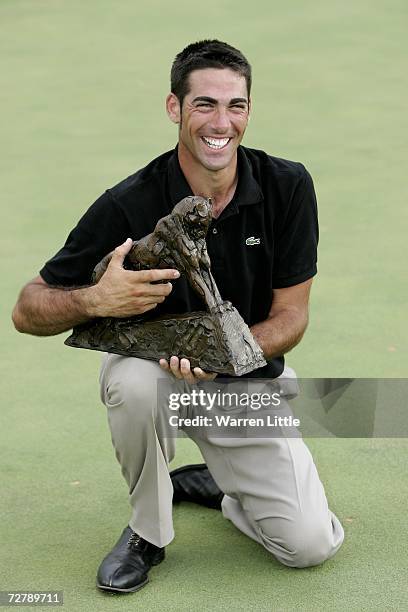 Alvaro Quiros of Spain poses with the trophy after winning The Dunhill Championships on a score of 275 at The Leopard Creek Country Club on December...