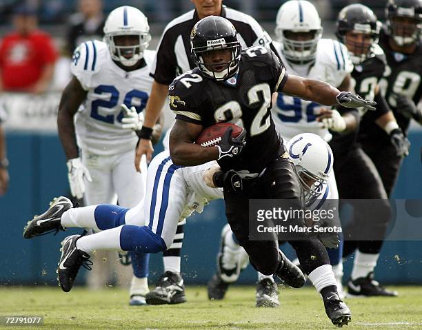Running Back Maurice Jones-Drew of the Jacksonville Jaguars runs the ball against the Indianapolis Colts on December 10, 2006 at Alltel Stadium in...