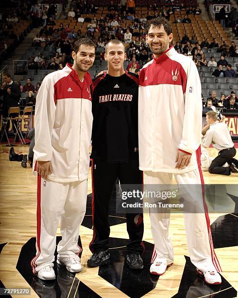 Sergio Rodriguez of the Portland Trail Blazers poses with Jose Calderon and Jorge Garbajosa of the Toronto Raptors before a game on December 10, 2006...