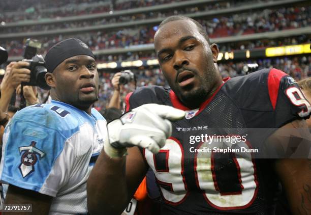 Quarterback Vince Young of the Tennessee Titans greets defensive lineman Mario Williams of the Houston Texans after the game on December 10, 2006 at...