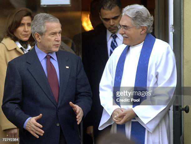 President George W. Bush talks to Rev. Louis Leon after attending a Sunday morning service at St. John's Episcopal Church December 10, 2006 in...