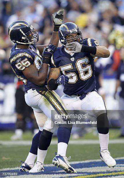 Luis Castillo and Shawne Merriman of the San Diego Chargers celebrate after a sack and a fumble against the Denver Broncos in the fourth quarter...