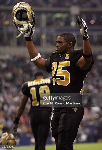 Running back Reggie Bush of the New Orleans Saints celebrates a touchdown after a challenge against the Dallas Cowboys in the third quarter at Texas...