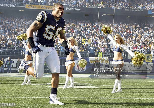 Shawne Merriman of the San Diego Chargers runs onto the field during introductions before taking on the Denver Broncos December 10, 2006 at Qualcomm...