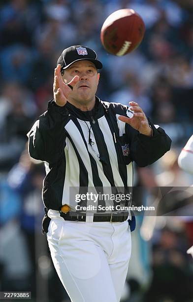 Game official Bruce Stritesky puts a new ball in play during the game between the Carolina Panthers and the New York Giants at Bank Of America...