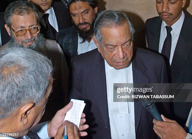 Saeed Sheikh father of Sheikh Omar, a British-born Islamic militant sentenced to death for killing US reporter Daniel Pearl, listens as his lawyer...