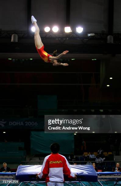 Huang Shanshan of China performs during the Women's Individual Qualification Gymnastics Trampoline Competition during the 15th Asian Games Doha 2006...