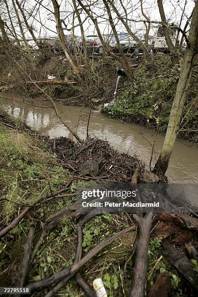 Water pours from a pipe into a stream where the naked body of prostitute Tania Nicol was found on December 11, 2006 in Ipswich, England. Police have...