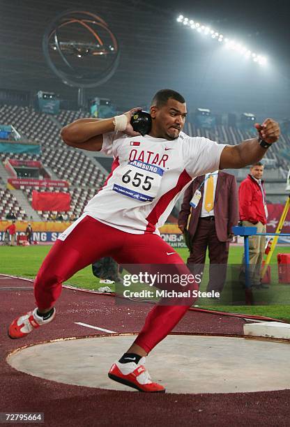 Khaled Habash M Al Suwaidi of Qatar competes in the Men's Shot Put during the 15th Asian Games Doha 2006 at the Khalifa Stadium December 11, 2006 in...