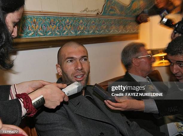 French football star Zinedine Zidane speaks to the media after his arrival at Houari Boumediene international airport 11 December 2006 in Algiers...