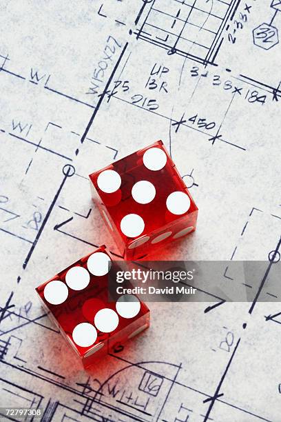 pair of dice on blueprint - red dice stock pictures, royalty-free photos & images