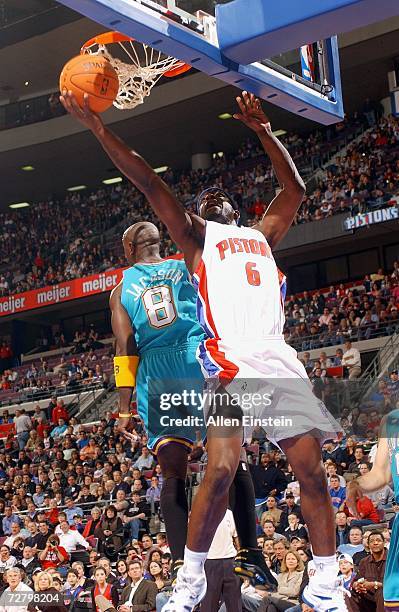 Ronald Murray of the Detroit Pistons goes to the hoop past Bobby Jackson the New Orleans/Oklahoma City Hornets on November 15, 2006 at the Palace of...