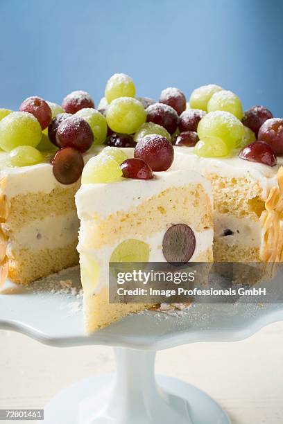 grape cake, a slice cut, on cake stand - cut layer cake stock pictures, royalty-free photos & images