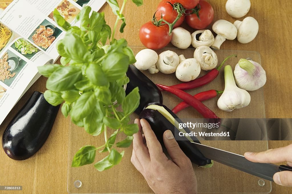 Man cutting vegetables, elevated view